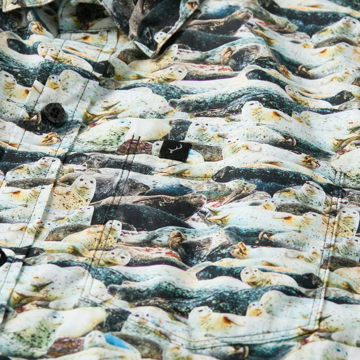 Close-up of Pladra Men's S/S Printed Outdoor Aloha Shirt - Seals; 100% cotton, beach seal print, buttons, stitching.