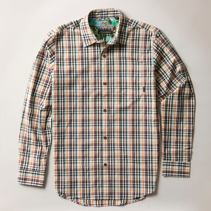 The Men's Tailwinds Shirt in Pebble Brown is a lightweight poplin, long-sleeve button-up featuring a blue, brown, and white multicolored plaid pattern, displayed flat on a light background.