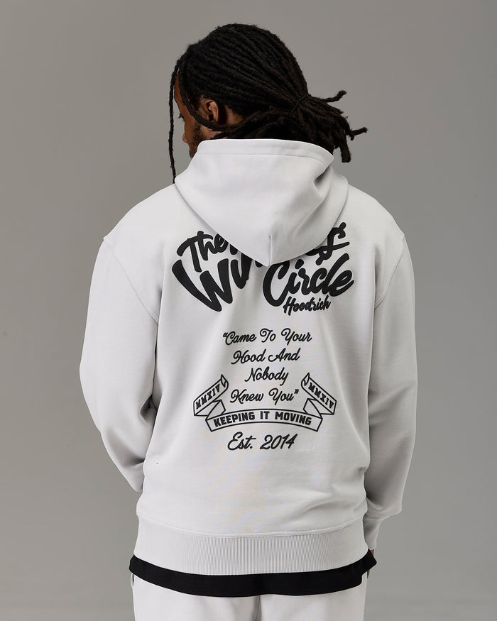 A person shown from the back wearing a white hoodie with a large black graphic print on the back. The hoodie features the text 'The Winners Circle' and additional motivational text.