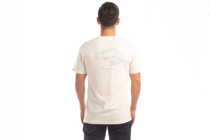 A man stands with his back to the camera, wearing the Men's Trout Tee in Tofu White Heather and dark pants, showcasing an outdoor lifestyle look against a white background.