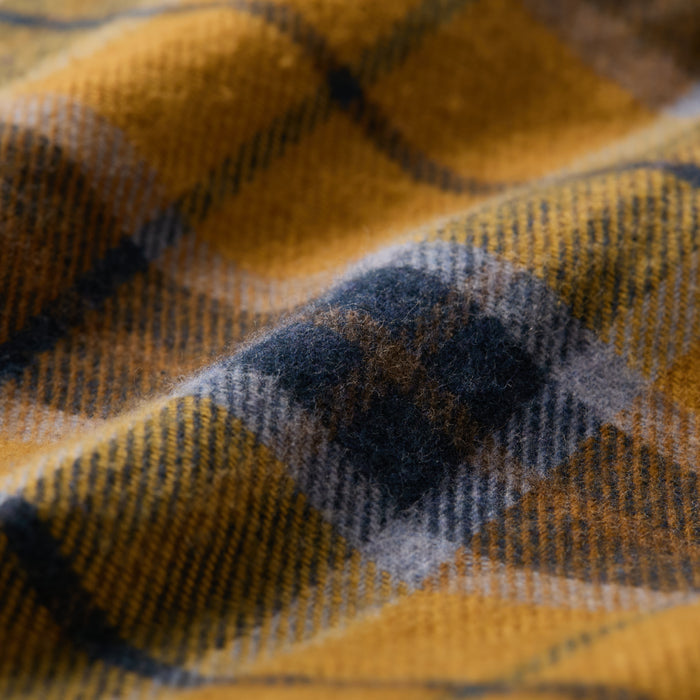 Close-up of Pladra Men's Workhorse Elite Flannel Shirt in Easton Gold, showing its soft, fuzzy, and textured fabric.