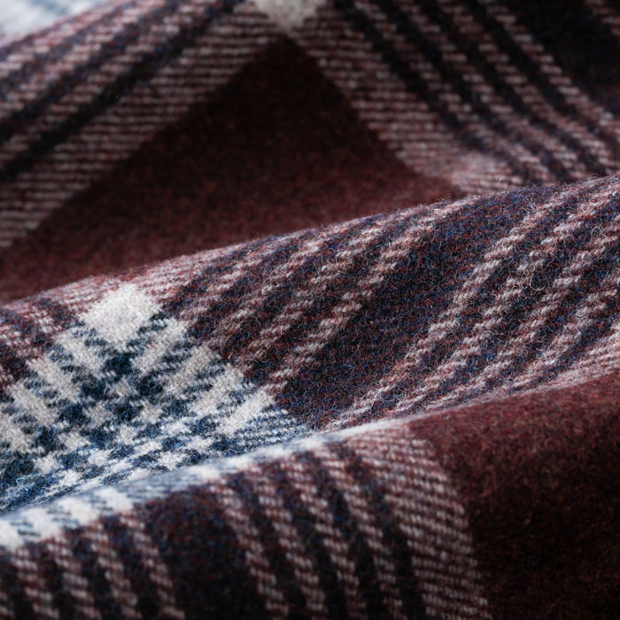 Close-up of Pladra Men’s Workhorse Wool Flannel Shirt in Redwood Red, showing its soft, woven texture and plaid pattern.