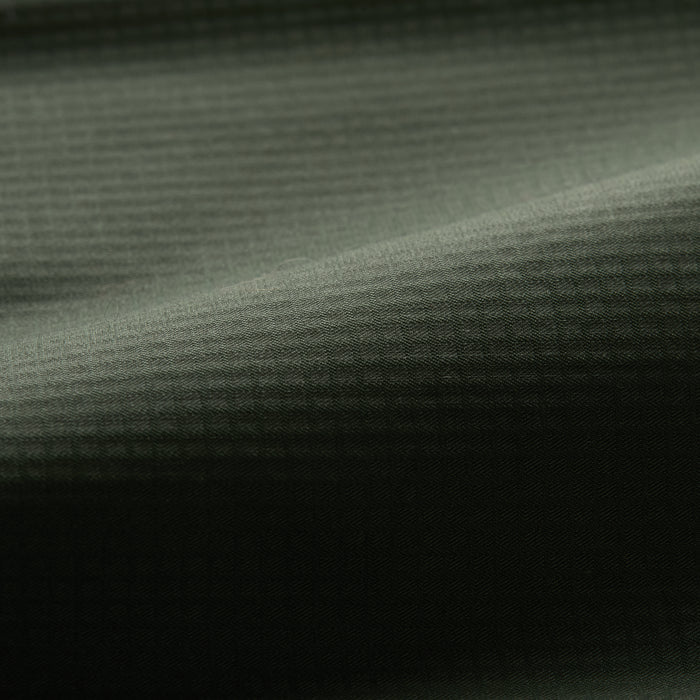 Close-up of Pladra Men's Yuba Fishing Shirt in Kombu Green—quick drying with a subtle checkered texture for anglers.