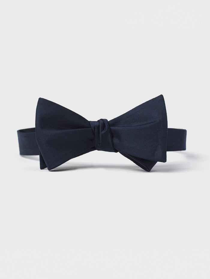 Midnight satin butterfly bow tie, tied, front view on white background