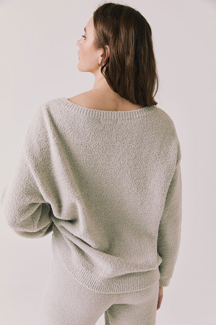 Back view of woman wearing Chaser’s Miller Heather Grey Pullover Sweater on a white background