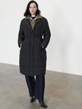 A woman wearing a black long-line puffer coat with a funnel neckline, long sleeves, concealed zip and popper fastening and 2 side pockets.