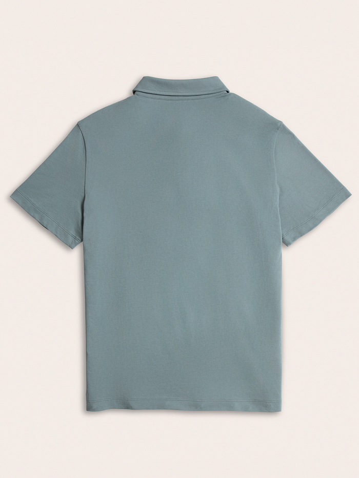 Light blue polo shirt flat lay, back view showing collar and short sleeves