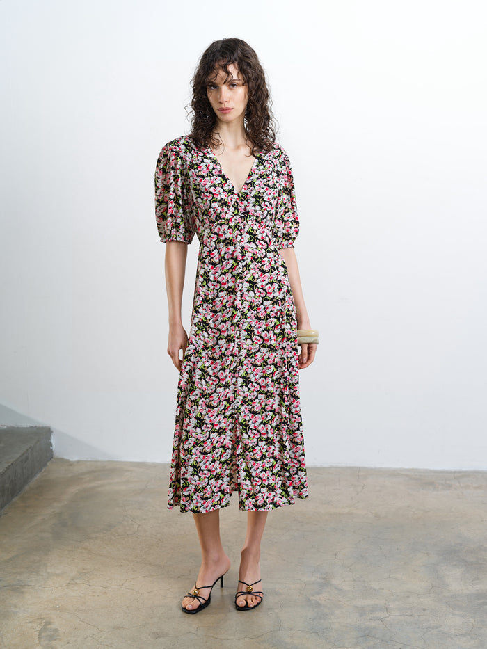 Woman wearing a V-neck floral midi dress