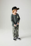 A full body front view of a boy wearing the Chaser Monster Truck Pants Boys Jogger on a neutral background