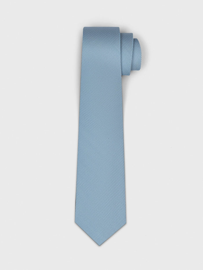 Light blue tie with a textured pattern, rolled at the top.