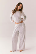 Heather grey ribbed long sleeve top with thumb holes and fitted shape.