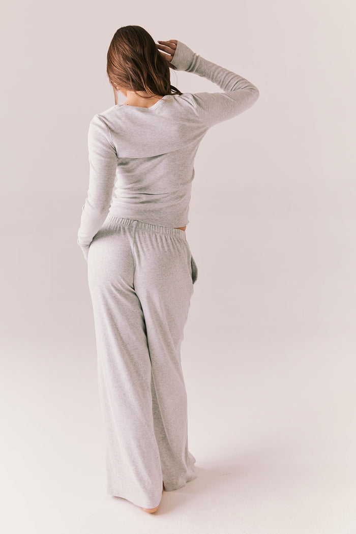 Heather grey ribbed long sleeve top with thumb holes and fitted shape.