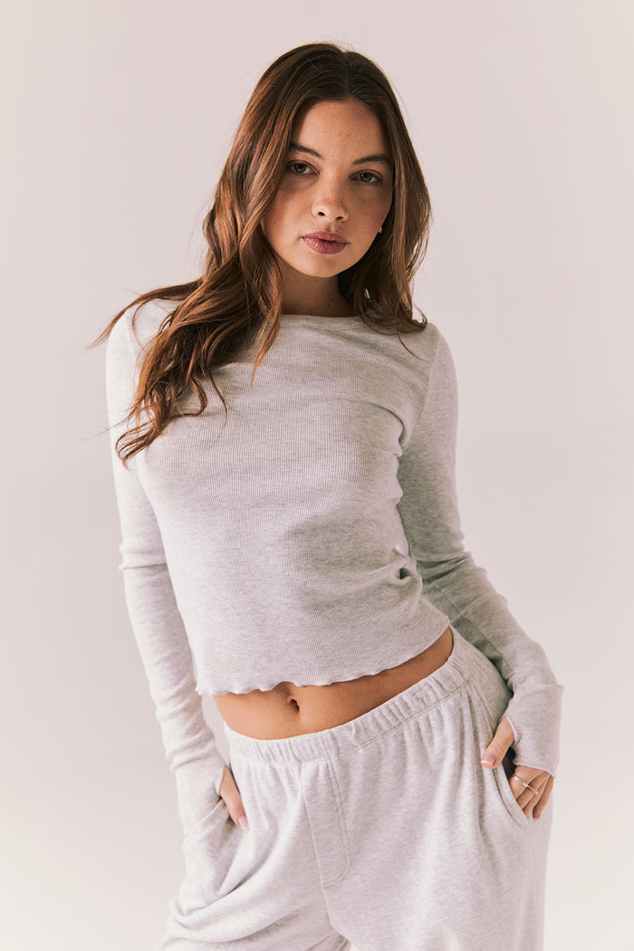 Heather grey ribbed long sleeve top with thumb holes and fitted shape.