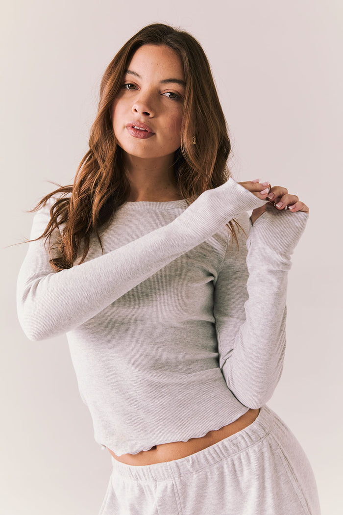 Heather grey ribbed long sleeve top with thumb holes and fitted shape.