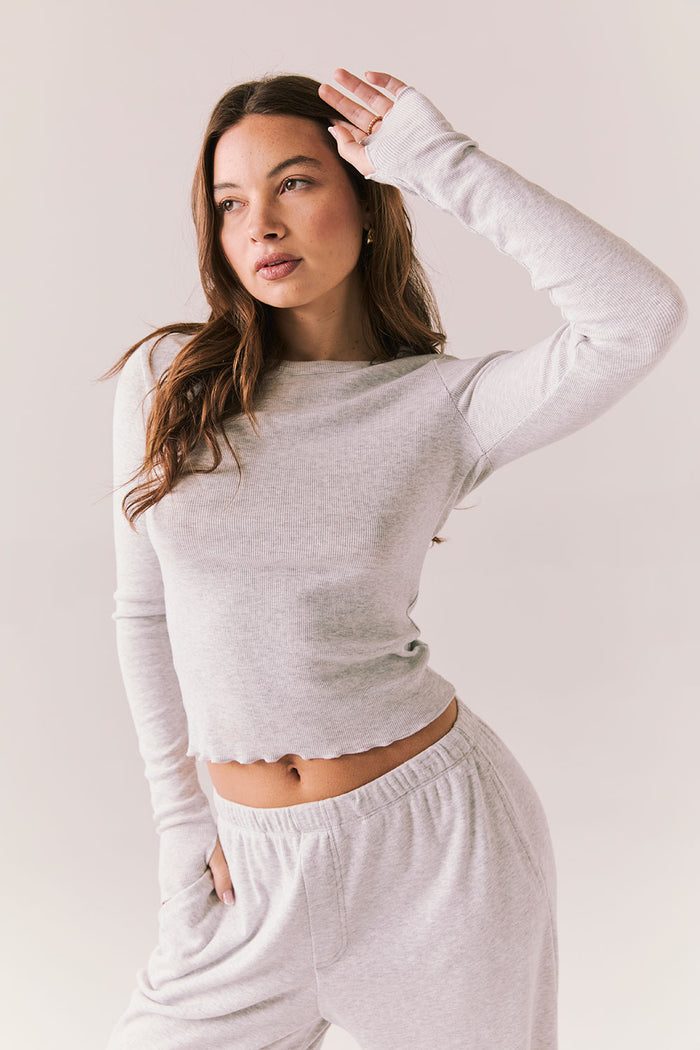 Heather grey ribbed long sleeve top with thumb holes and fitted shape.