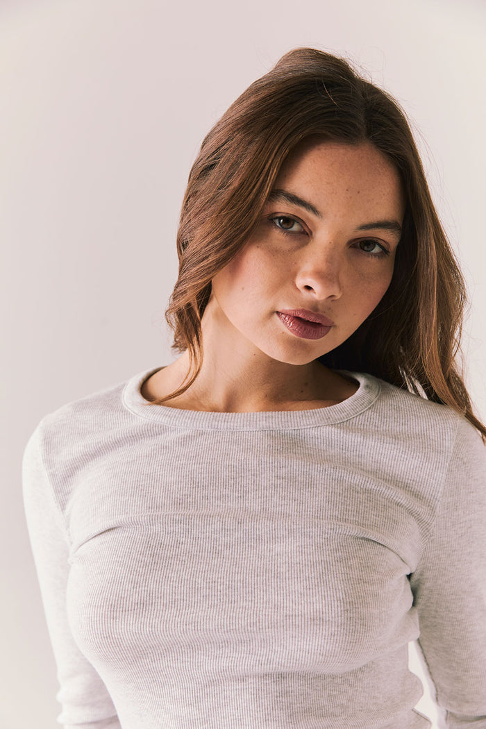 Heather grey ribbed long sleeve top with thumb holes and fitted shape.