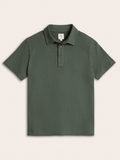 Moss green cotton pique polo shirt laid flat, front view, buttoned collar