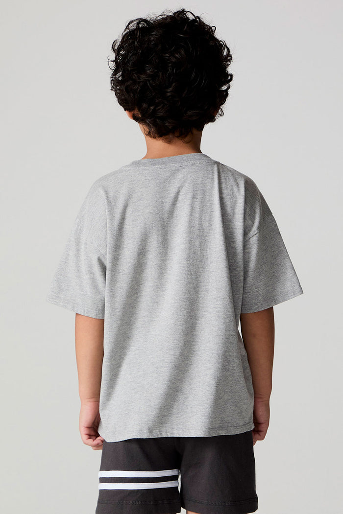 Back view of a boy wearing the Chaser  Moto LA Tee on a neutral background