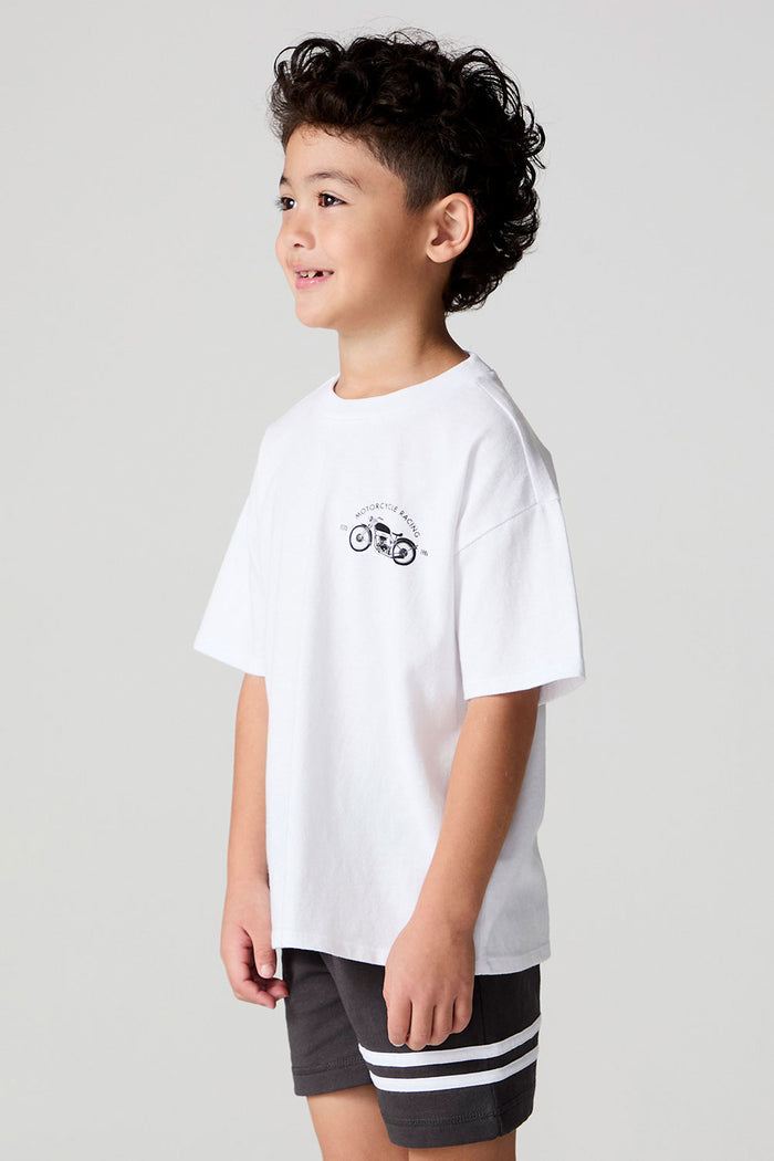 Side view of a boy wearing the Chaser  Motor Racing Tee on a neutral background