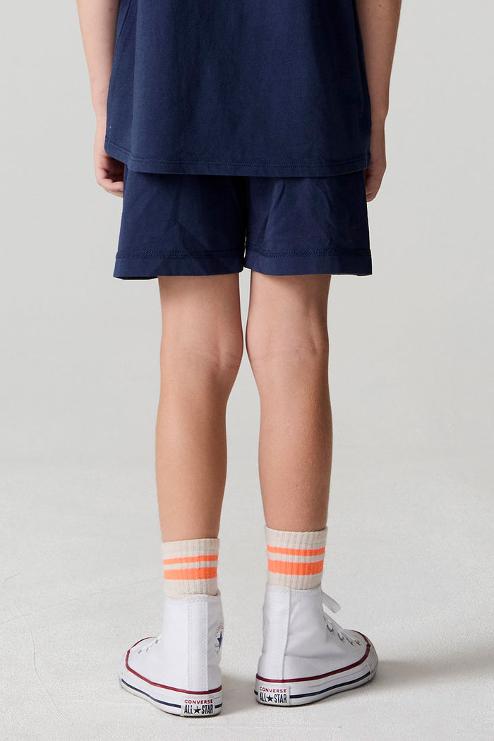 Back view of a boy wearing the Chaser Multi Bolt Shorts on a neutral background
