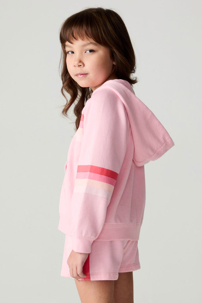 Side view of a girl wearing the Chaser Multi Stripes Girls Zip Up on a neutral background with arms at sides