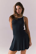 Front detail view of Chaser Brand Myrina Licorice Black Mini Dress showing the contrast neckline and smooth fitted bodice