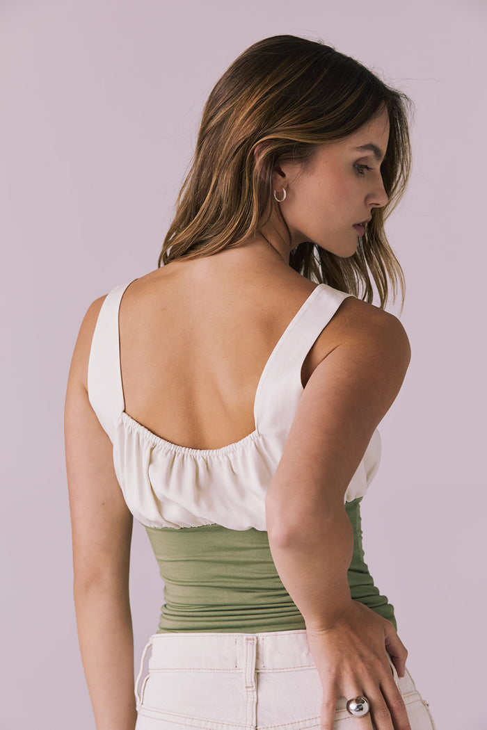 Back angle of the Chaser Nancy Meadow Green Tank highlighting the wide straps and softly gathered upper panel