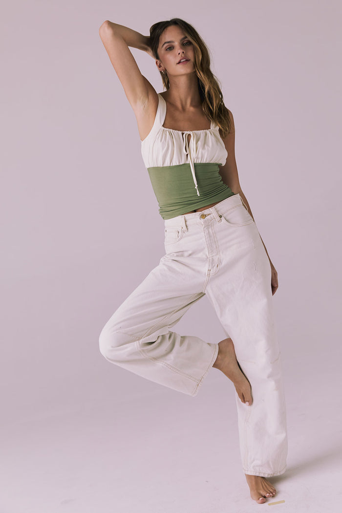 Full body front shot of the Chaser Nancy Meadow Green Tank paired with relaxed white denim for a casual summer vibe