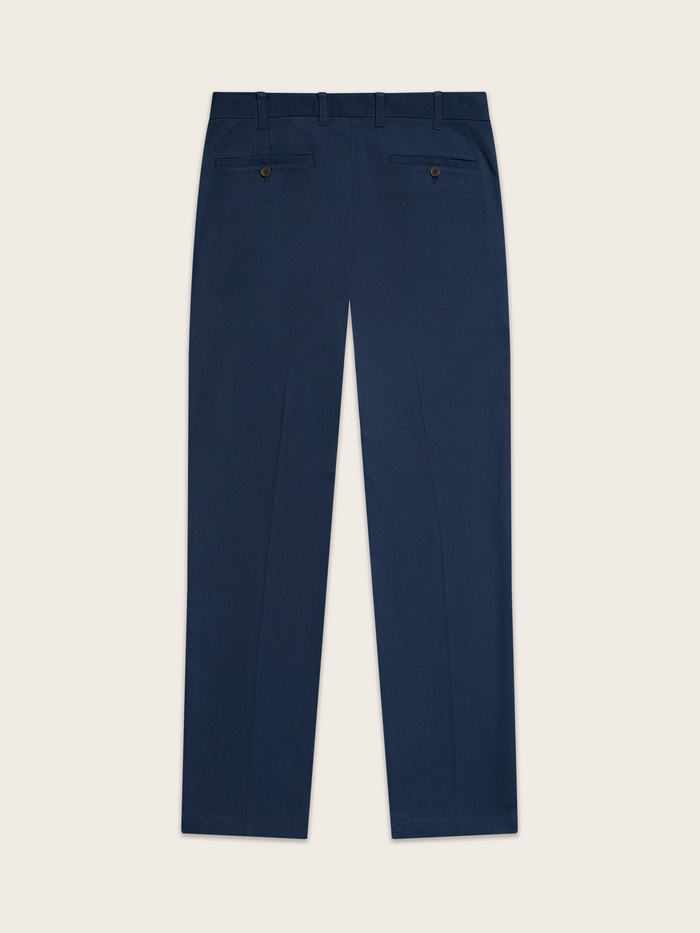 Navy chino pants laid flat, back view, welt pockets with button visible