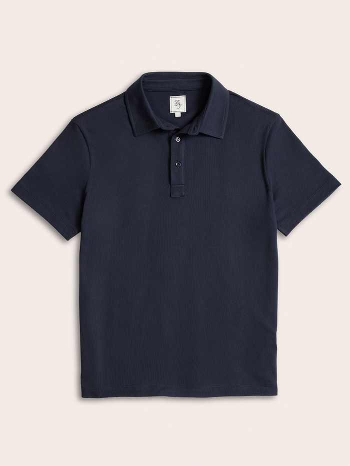Navy cotton pique polo shirt laid flat, front view, buttoned collar