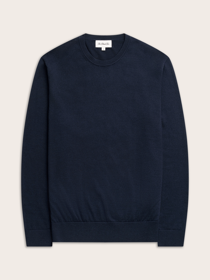 Navy crewneck sweater laid flat, front view