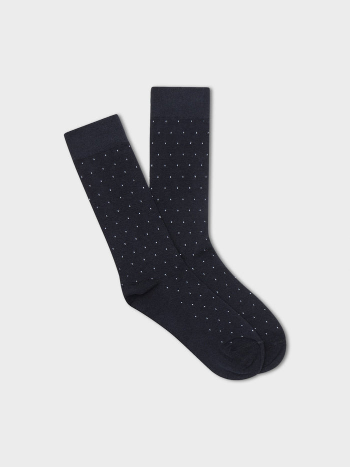 Navy pindot dress socks folded flat, white polka dot pattern
