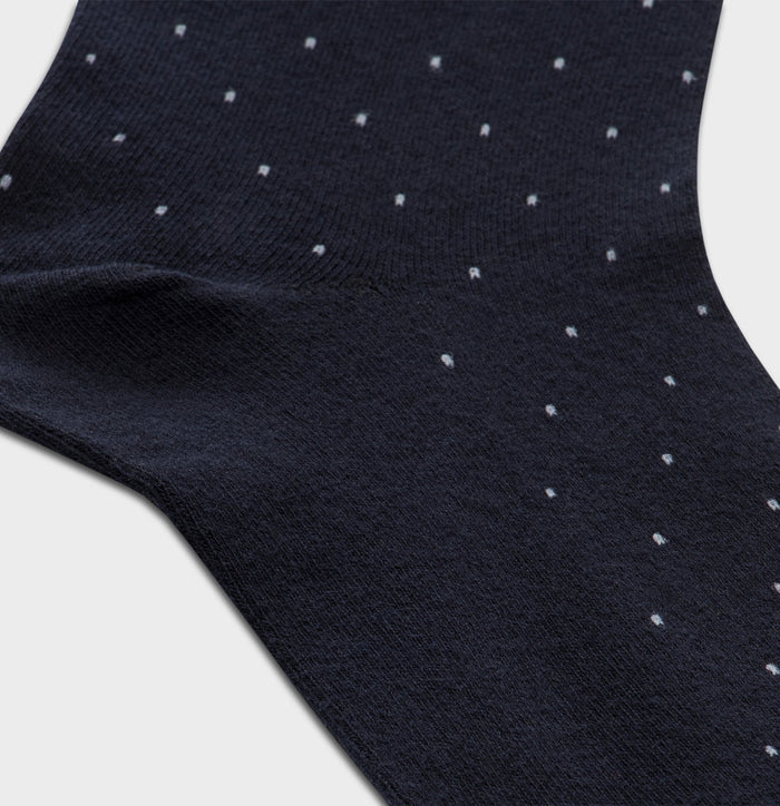 Close-up of navy pindot dress sock texture and heel detail