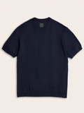 Navy sweater knit tee laid flat, short sleeves, crew neckline