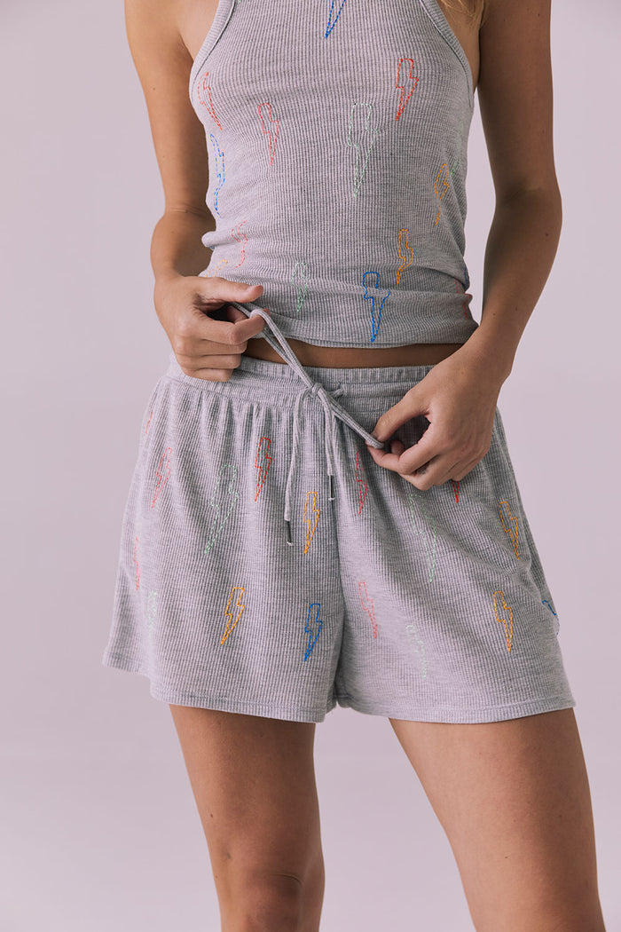 Chaser Neon Bolt Stitches Short in Heather Grey shown in a detail view featuring the drawstring waistband and scattered neon bolt accents