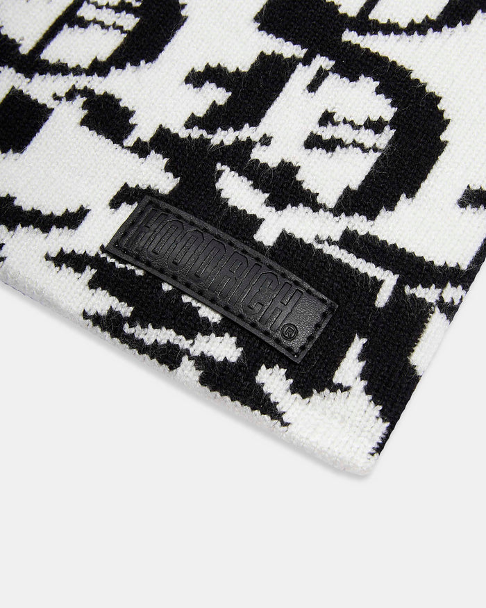 Black and white patterned fabric with a brand logo tag.