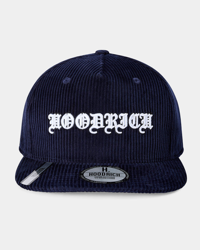 Navy blue corduroy cap with white text on a light gray background