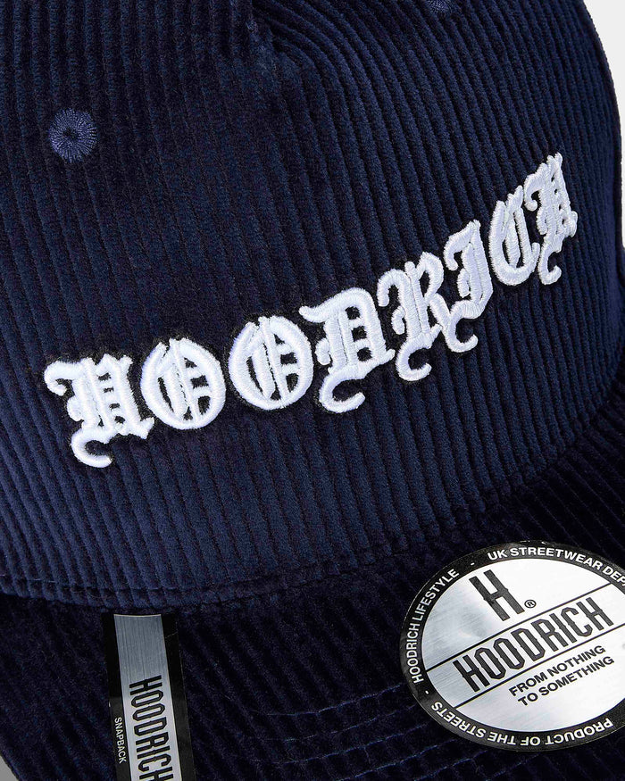 Navy blue cap with white embroidered text and Hoodrich logo on a dark background