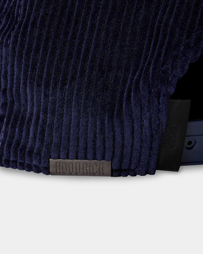Navy blue textured fabric with a brand label on a white background