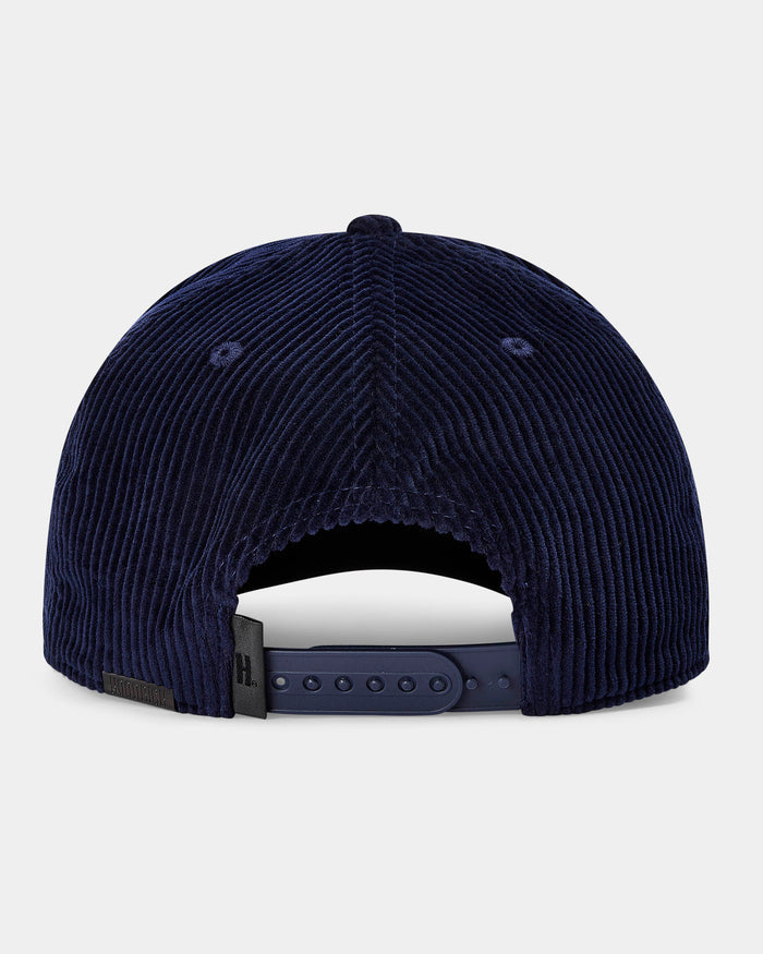 Navy blue corduroy cap on a light gray background
