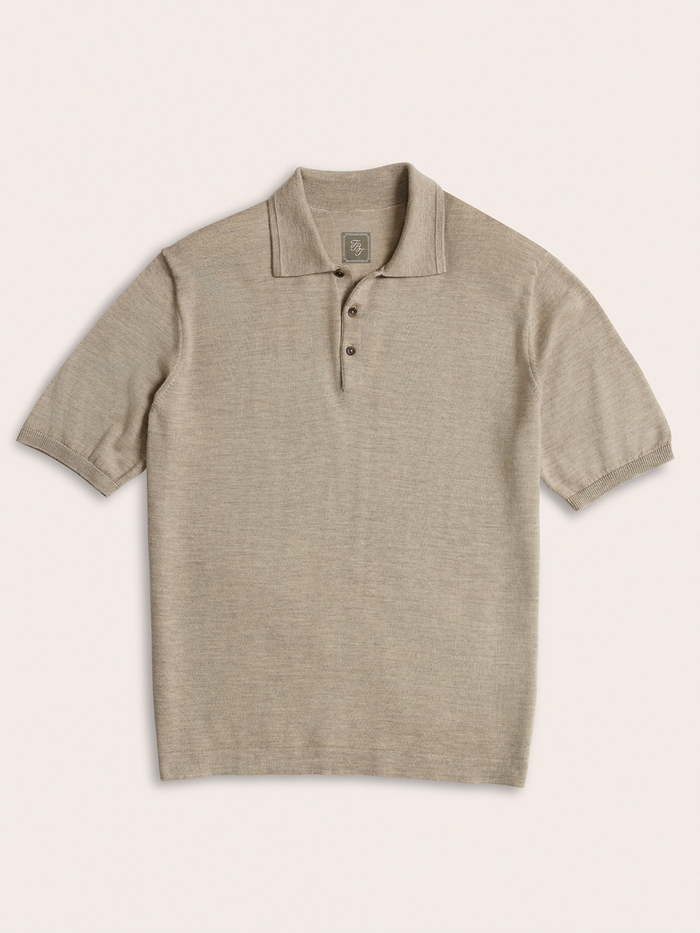Oatmeal knit polo shirt laid flat, front view, on cream background