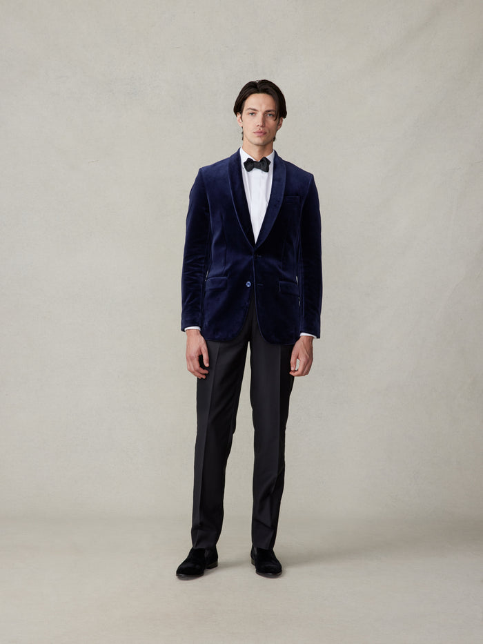 Man in an ocean blue velvet tuxedo full length