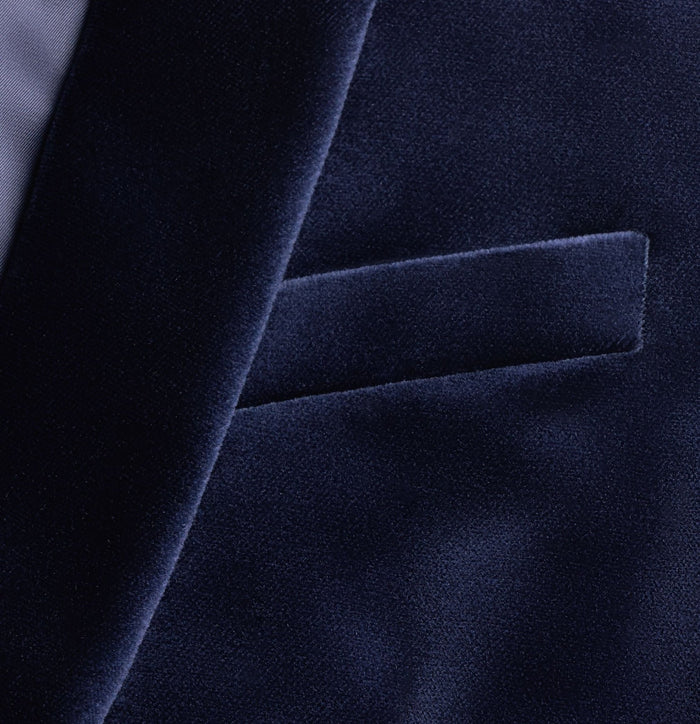 Close-up of ocean velvet tuxedo jacket chest welt pocket and shawl lapel edge