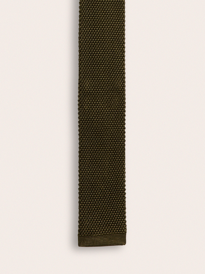 Olive green knit silk tie laid flat, straight view, on cream background