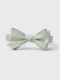 Pale seafoam green silk bow tie on white background