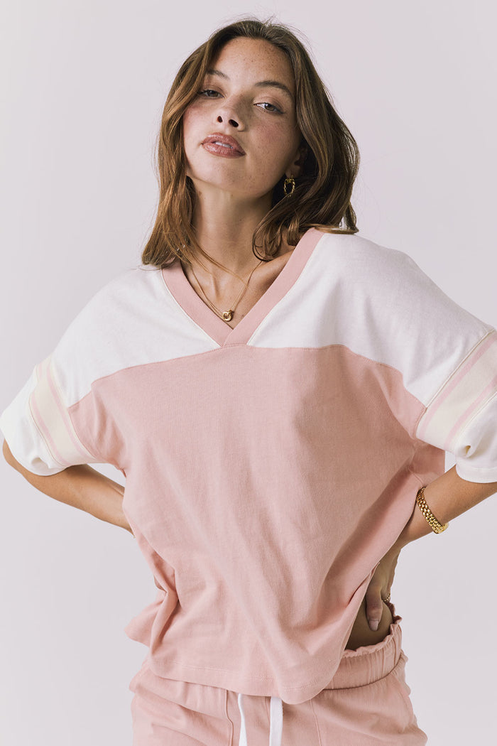 Chaser Palmer Tee in Starry White and Delicate Honey shown front with hands on hips emphasizing the relaxed fit and elastic waist detail
