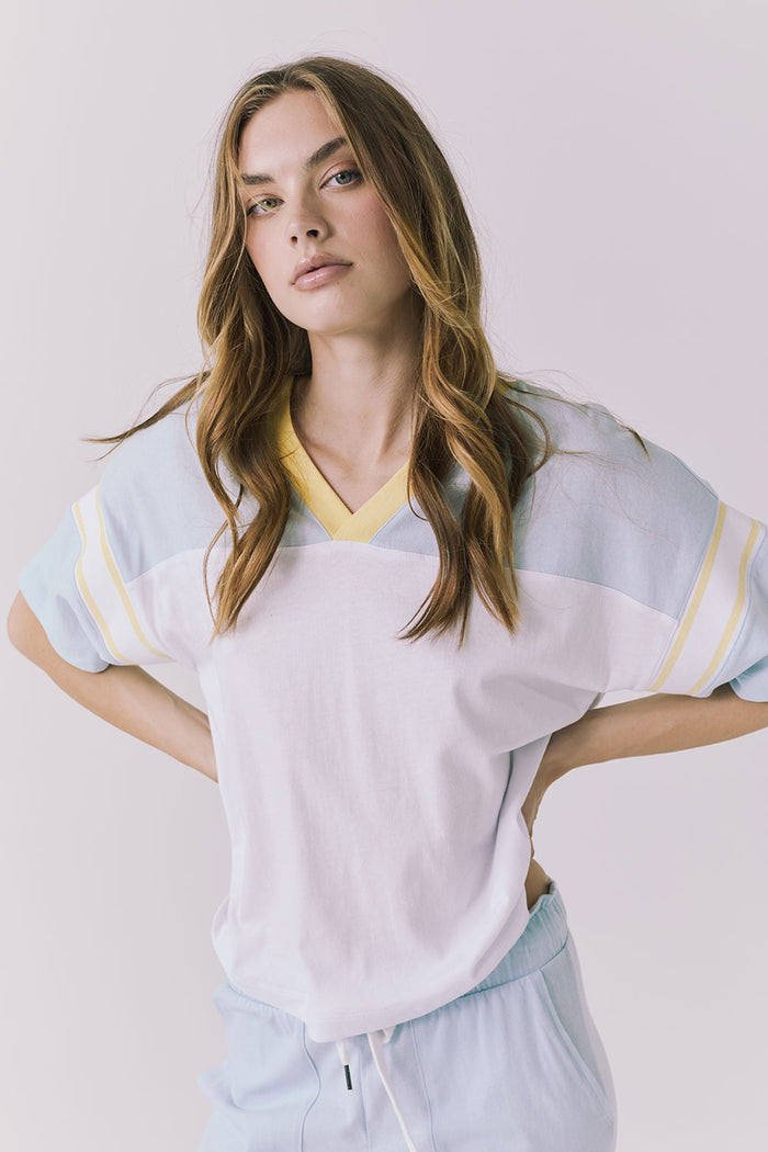 Chaser Palmer Tee in White with Mineral Butter trim featuring a relaxed fit V neckline and soft contrast sleeve stripes