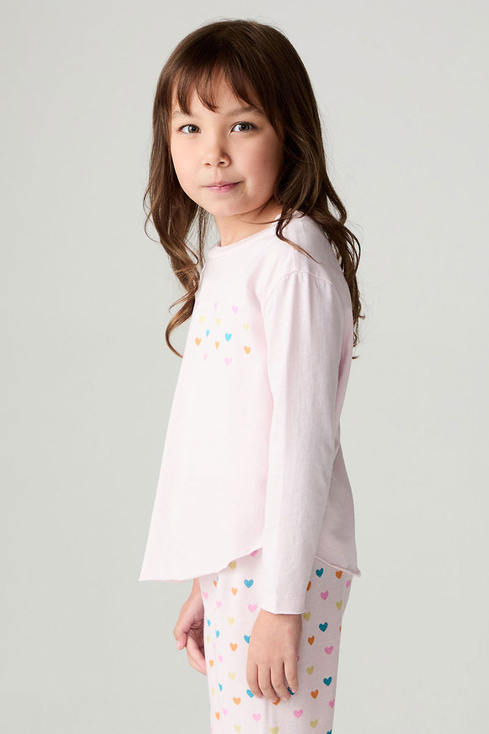Side view of a girl wearing the Chaser Party Hearts Girls Tee on a neutral background with shirt