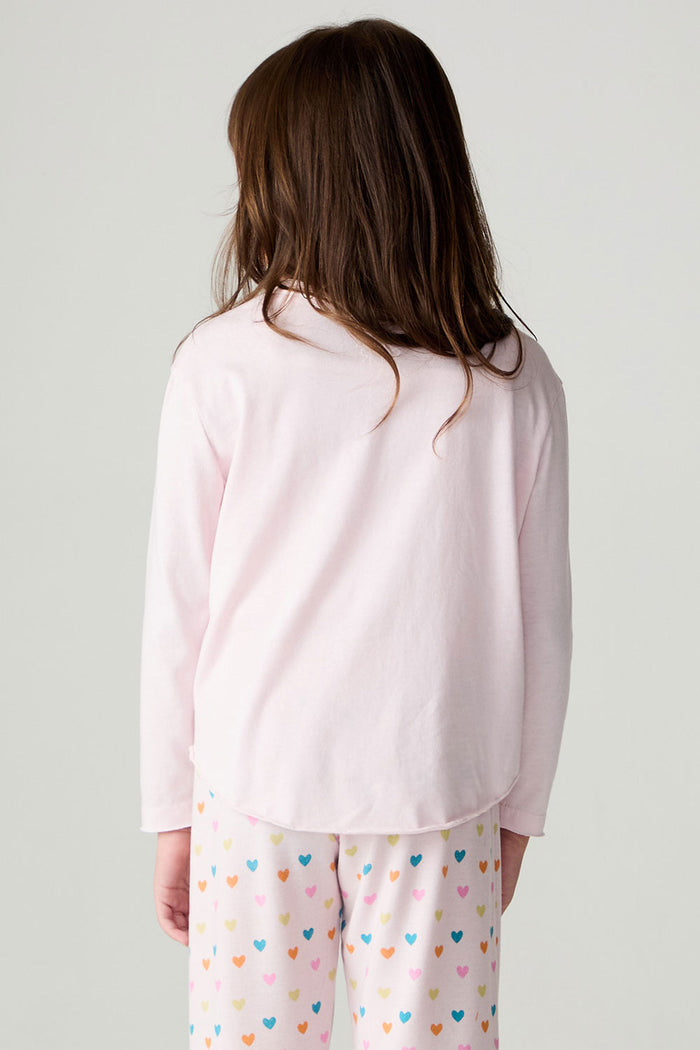 Back view of a girl wearing the Chaser Party Hearts Girls Tee on a neutral background