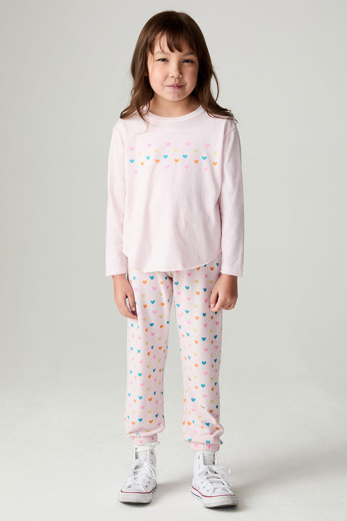 A full body front view of a girl wearing the Chaser Party Hearts Girls Tee on a neutral background